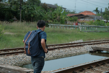 A young man traveling and traveling alone