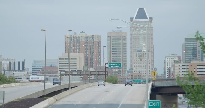 A police cruiser drives down I-83 in downtown Baltimore.