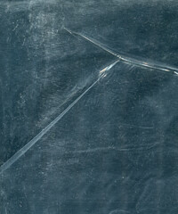 photo texture crumpled polyethylene of a dark shade of color