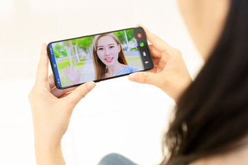 Asian woman has video chat