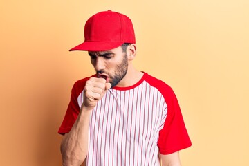Young handsome man with beard wearing baseball cap and t-shirt feeling unwell and coughing as symptom for cold or bronchitis. health care concept.