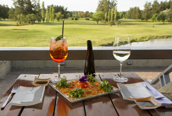 Gourmet food. Elegant sushi restaurant. Outside table set up and dish presentation. Raw salmon...