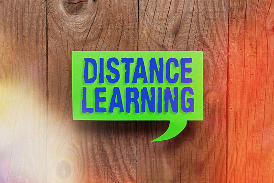 Conceptual hand writing showing Distance Learning. Concept meaning educational lectures broadcasted over the Internet remotely Paper accessories with smartphone on different background - Powered by Adobe