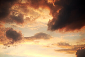 Dramatic twilight sky with clouds. Colorful cloudscape and atmosphere. Vivid sunset lights in the sky