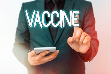 Writing note showing Vaccine. Business concept for preparation of killed microorganisms or living...