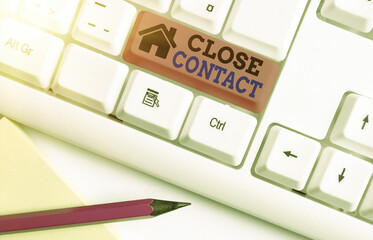 Writing note showing Close Contact. Business concept for having a history of direct exposure to a...