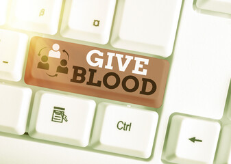 Handwriting text writing Give Blood. Conceptual photo an individual voluntarily has blood drawn and...