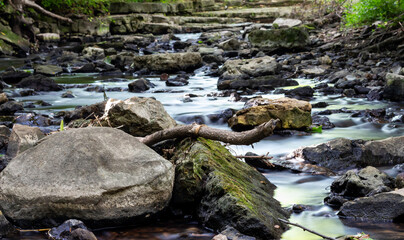 Naklejka na ściany i meble Rocks in a River Long Exposure