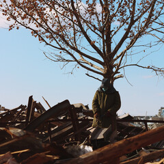 Worker in front of a tree, sense of hope