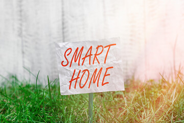 Conceptual hand writing showing Smart Home. Concept meaning equipped home can be controlled...