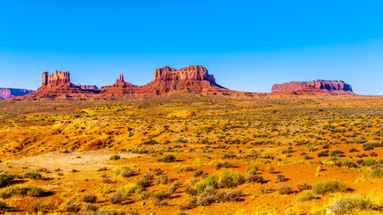 The towering sandstone Buttes and Mesas of Stagecoach, Big Indian, Sentinel and Mitchell Mesa in...