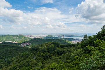 Fototapeta premium Mountain climbing overlooking the city