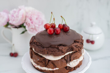 black forest chocolate cake with cherry pie filling with dark chocolate glaze