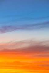 Amazing blue, orange and yellow colors sunset sky gradient vertical background