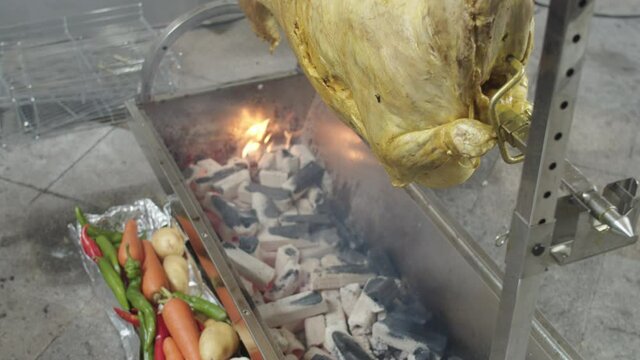 Whole brine lamb spins and roasted on charcoal roaster. Lamb BQ