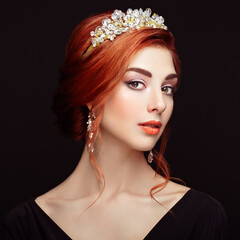 Beautiful girl in the crown and earrings. Perfect makeup. Beauty fashion. Cosmetic. Elegant hairstyle