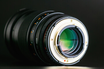 Close up of the camera lens with the back side of the bayonet on a black background