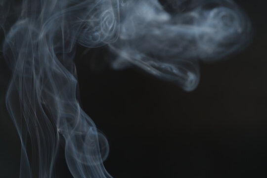 White smoke, curly black background, used as the background image.