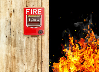 pulling fire alarm on the wall next to the door