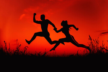 Fototapeta na wymiar silhouette of a sports pair of men and girls engaged in training jumps