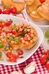 Friselle with tomatoes and chickpeas.	