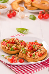 Friselle with tomatoes and chickpeas.	