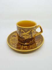 Sugar bowl with flower, tea cup and small jug for milk.