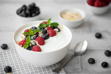 fresh greek yogurt with blueberries, raspberries and mint