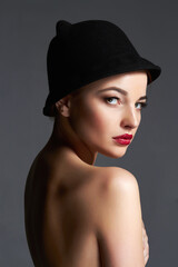 Beautiful naked woman in hat. nude body girl with make-up and Hat