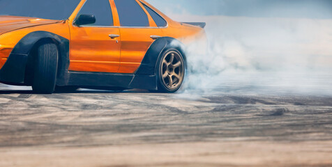 Fototapeta na wymiar Race drift car burning tires on speed track