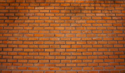 Wall of natural brown color clay brick in background