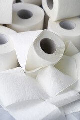 Toilet paper in a roll. Snow-white soft three-layer toilet paper. Lack of hygiene products. Primary protection and disinfection.