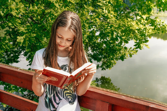 Happy Little Girl Read Book In Summer Park. Summer Reading List, For Your Reading Pleasure.