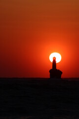 Sunrise at the lighthouse of Tourlitis at Andros, Greece 