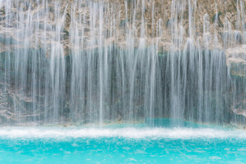 landscape of beautiful Artificial waterfall in garden at the public park