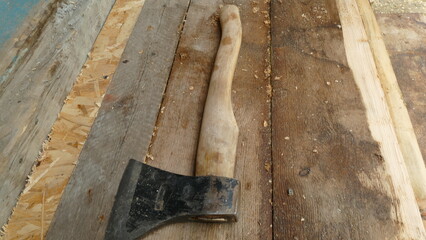 carpenter's tool an axe on the boards lies