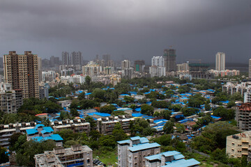 Mumbai, Maharashtra, India; building and slum's aerial view
