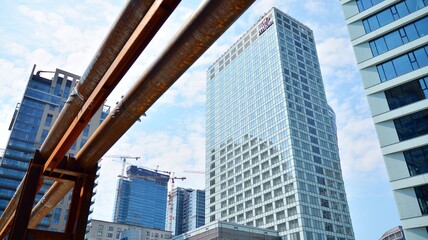 Fototapeta premium Building site with cranes and blue sky