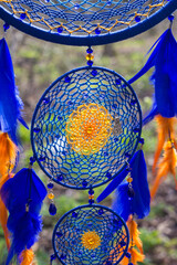 Obraz premium Handmade dream catcher with feathers threads and beads rope hanging