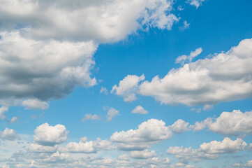 Beautiful background of blue sky with fluffy clouds