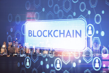 Multi exposure of cryptocurrency theme hologram drawing and city veiw background. Concept of blockchain and bitcoin.