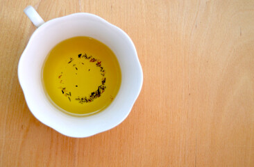 
Tea with thyme in a white cup