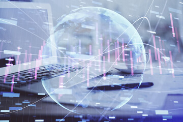 Forex graph hologram on table with computer background. Double exposure. Concept of financial markets.