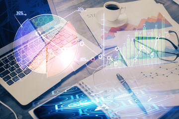 Double exposure of forex chart and work space with computer. Concept of international online trading.