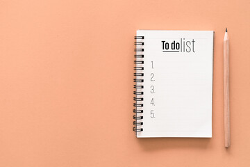 Notebook and pencil with to do list words on pastel color background. - obrazy, fototapety, plakaty