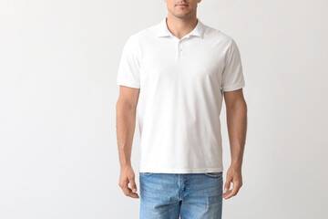 Young man in stylish t-shirt on light background