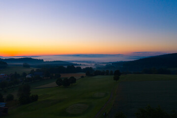 Drone panorama photo - dawn with early fog at blue hour