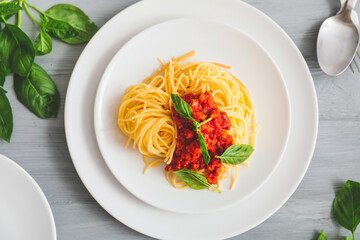 Plate with tasty pasta bolognese on table