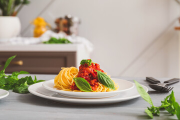 Plate with tasty pasta bolognese on table