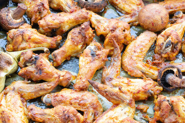 Oven - baked chicken wings with mushrooms